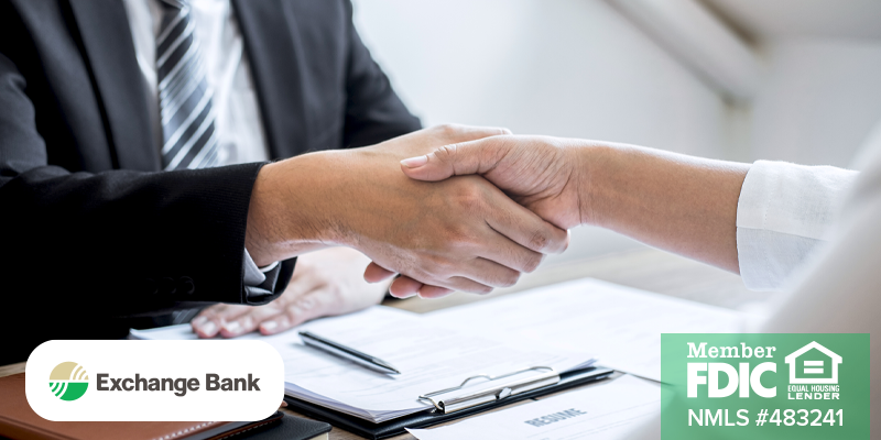 Person in interview shaking hands with hiring person