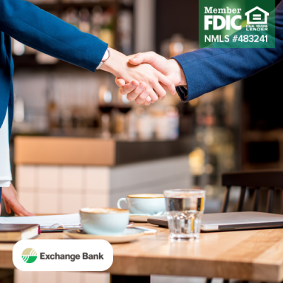 Business owner and business banker shaking hands
